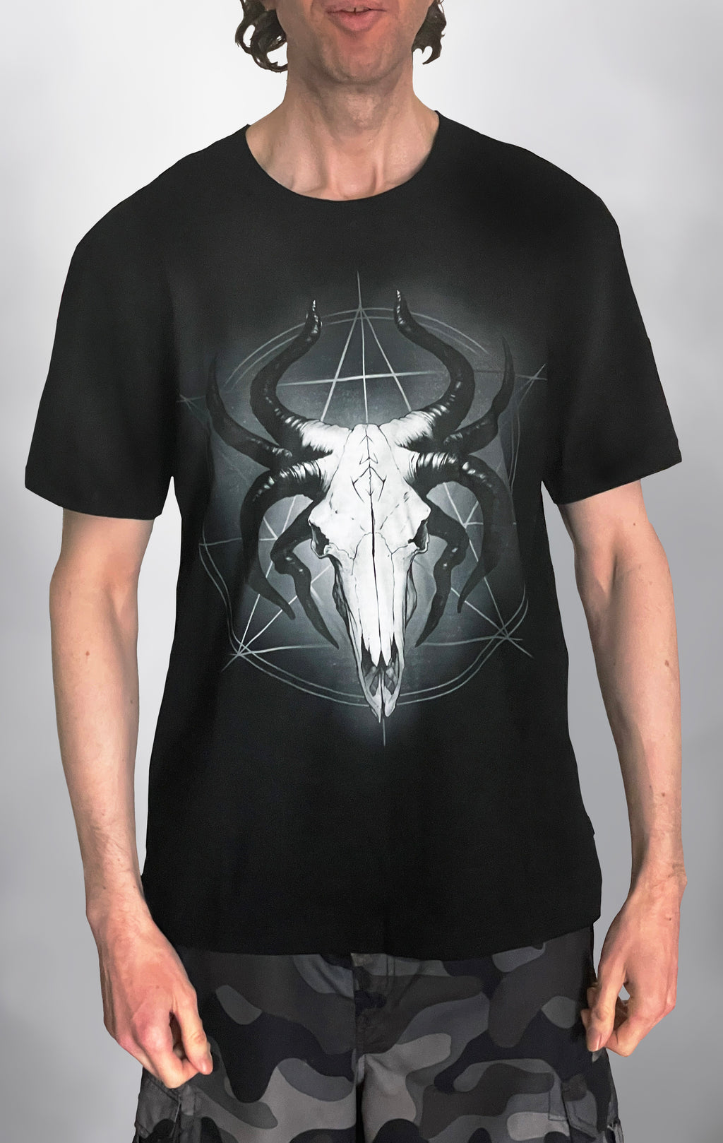 Glowing God of the Void: The Horned Skull Deity T-Shirt